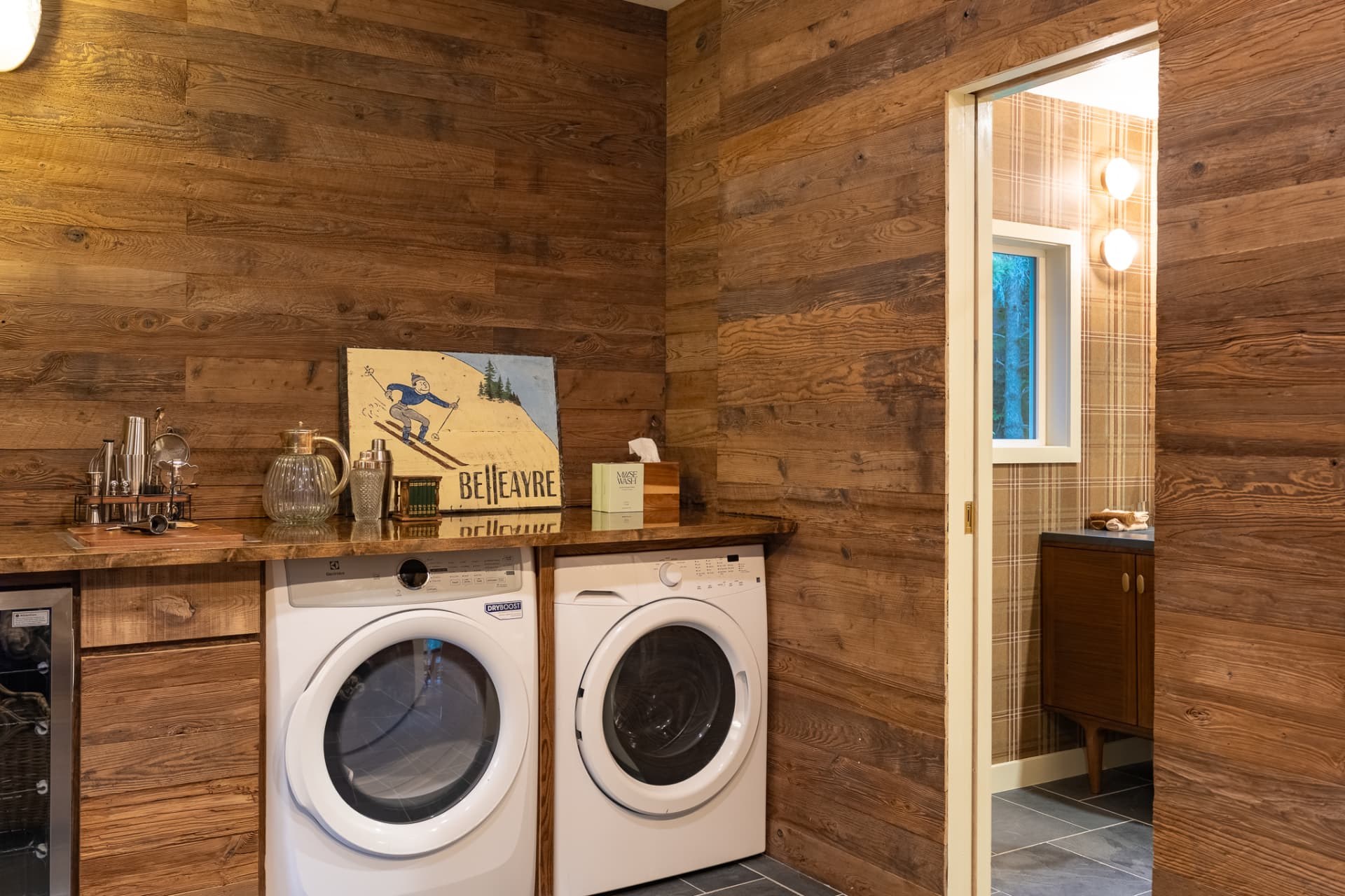 Washer and dryer in the wood-paneled laundry room